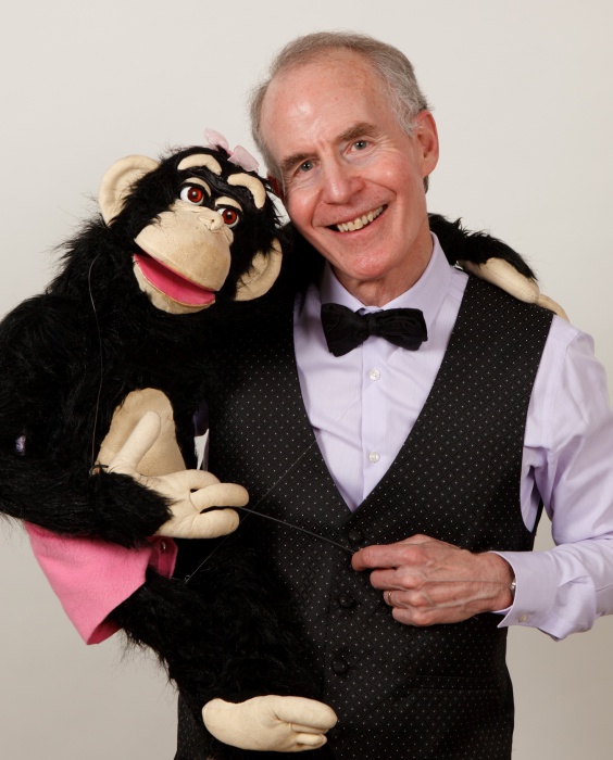 Award winning Ventriloquist & Puppeteer Mark Hellerstein holding Monkey Puppet