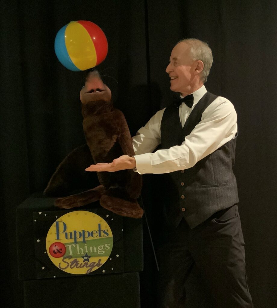 Ventriloquist with seal puppet